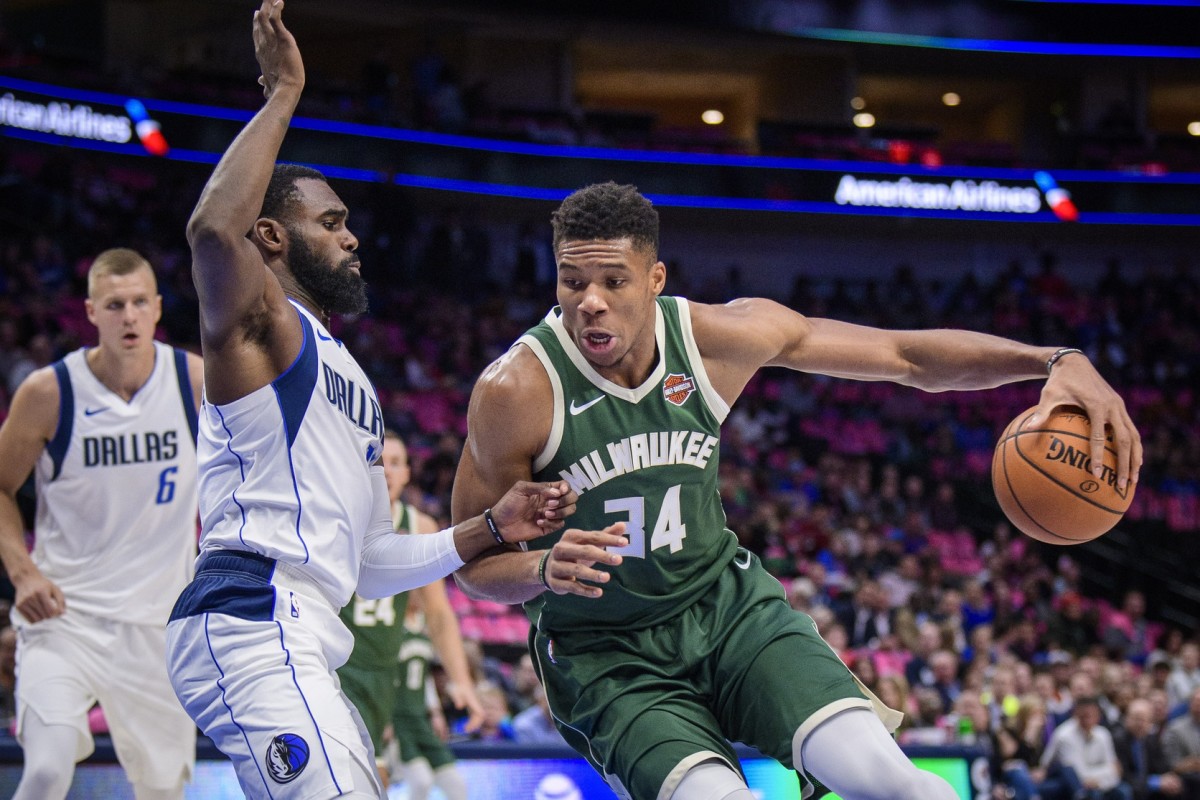 Dallas Mavericks guard Tim Hardaway Jr. (11) defends against Milwaukee Bucks forward Giannis Antetokounmpo (34)